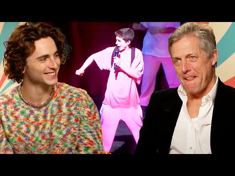 Hugh Grant Learns About Timothée Chalamet’s ‘Timmy Tim’ Rap Origins (Exclusive)