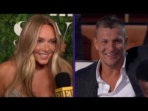 Camille Kostek REACTS to Gronk’s BURNS at Tom Brady Roast (Exclusive)