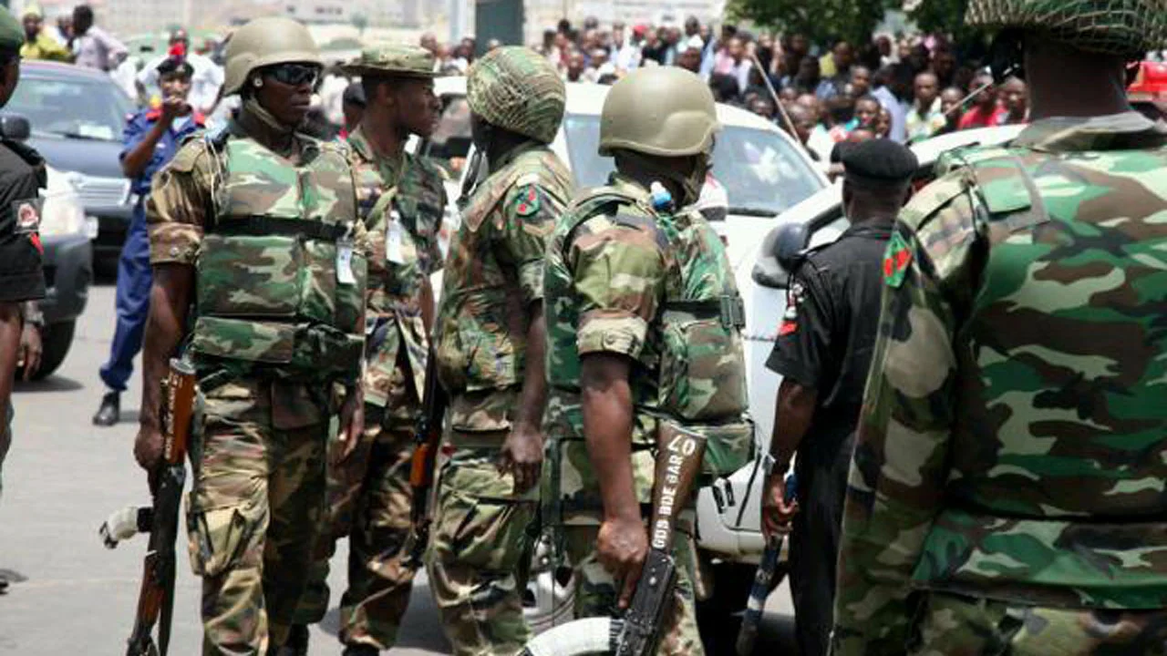 BREAKING: NLC Members Cry Out As Soldiers Surround Venue Of Their Meeting With FG